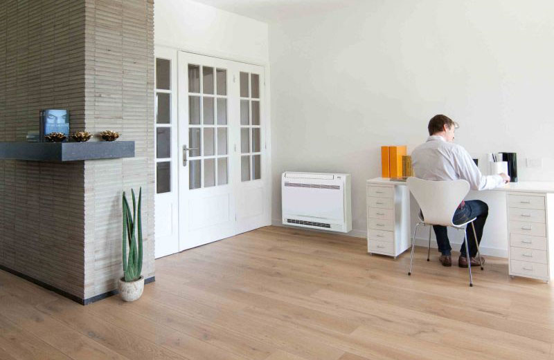A floor standing air conditioner installed in a home office.
