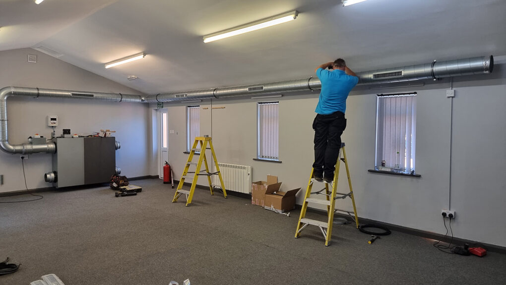 Torr Engineering's Andy Linton puts the finishing touches to the supply air ductwork.